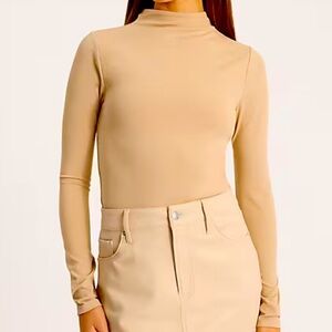 Express Body Contour High Compression Mock Neck Long Sleeve Tee in Beige